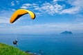 Colorful hang glider in sky