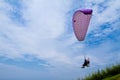 Colorful hang glider in sky