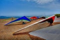 Colorful hang gliding wings lined up on top of a cliff at Fort F