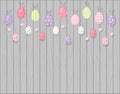 Colorful hanging easter eggs. Rustic wooden background. Cartoon style Royalty Free Stock Photo