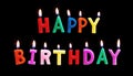 Colorful Happy Birthday Candles, on black background Royalty Free Stock Photo