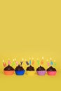 Colorful Happy Birthday Cupcakes With Candles Royalty Free Stock Photo