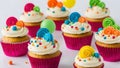 Colorful happy birthday cupcakes white isolated background.