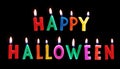 Colorful Happy Halloween candles, on black background Royalty Free Stock Photo