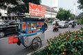 Colorful hawkers sell food by the street in Jakarta