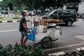 Colorful hawkers sell food by the street in Jakarta