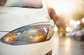 Colorful headlights of white car after the rain at night Royalty Free Stock Photo