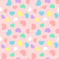 Colorful heart random size seamless pattern on pink background vector. Punchy pastel color, minimalist style.