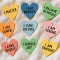 Colorful heart-shaped affirmation notes with positive messages. Royalty Free Stock Photo