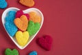 Colorful heart shaped jelly candy sweets isolated on red background Royalty Free Stock Photo