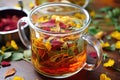 colorful herbal tea leaves steeping in a cup