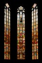 A colorful, high stained glass window inside of the Christian church Royalty Free Stock Photo
