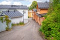 Colorful historic houses in the Old Town of Naantali, Finland. Lots of tourists are wandering around on these streets during the