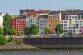 Colorful historical buildings in Hamburg harbor at Elbe river shore seen from water, Germany