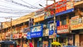 Colorful hoardings and signs of small businesses along the street, at Vijayawada, India