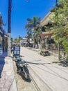 Colorful Holbox island village with stores mud and people Mexico