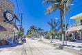 Colorful Holbox island village with stores mud and people Mexico