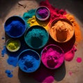 colorful holi colors in bowls. Colorful holi powder blowing up. Holi festival and celebration. Top view on multicolored Royalty Free Stock Photo