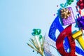 Colorful holiday background with party accessories on blue background Royalty Free Stock Photo