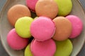 Colorful Homemade French Macarons on a Plate, top view. Flat lay, overhead, from above. Close-up