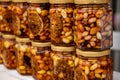 Colorful honey with fruit and nuts in the jar