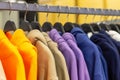 Colorful hoodies on hangers in a sports store close-up Royalty Free Stock Photo