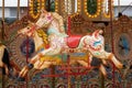 Colorful horses on a children carousel