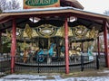 Colorful horses and peacock on carousel ride