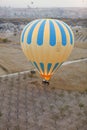 Colorful Hot Air Balloon With Basket In Field With Trees Royalty Free Stock Photo