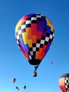 A Colorful Hot Air Balloon Floating above the Crowds Royalty Free Stock Photo