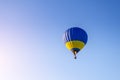 Colorful hot air balloon flying in the blue sky Royalty Free Stock Photo