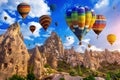 Colorful hot air balloon flying over Cappadocia, Turkey. Royalty Free Stock Photo