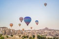 Colorful hot air balloon flying over Cappadocia, Turkey Royalty Free Stock Photo