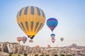 Colorful hot air balloon flying over Cappadocia, Turkey Royalty Free Stock Photo