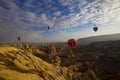 Colorful hot air balloon flying over Cappadocia, Turkey. Royalty Free Stock Photo