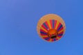 Colorful hot air balloon flying over fairy chimneys, Cappadocia, Turkey. Royalty Free Stock Photo