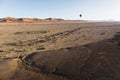 Colorful hot-air balloon flying over the high mountains in Namibia. High altitude. ( Namibia, South Africa)