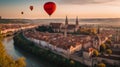 colorful hot air balloon flying over a medieval city with towers and churches at sunset - Royalty Free Stock Photo