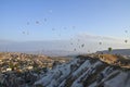 Colorful Hot air balloon flying over rocks and valley landscape at Cappadocia, Goreme Turkey Royalty Free Stock Photo