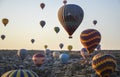 Colorful Hot air balloon flying over rocks and valley landscape at Cappadocia, Turkey Royalty Free Stock Photo