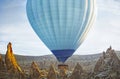 Colorful hot air balloon flying over the valley at Cappadocia