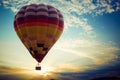 Colorful hot air balloon flying on sky at sunset Royalty Free Stock Photo