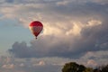 Colorful hot air balloon is flying at suset Royalty Free Stock Photo