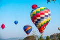 Colorful hot air balloon over mountain on blue sky Royalty Free Stock Photo