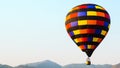 Colorful hot air balloon with sky and mountain background, with copy space for your text Royalty Free Stock Photo