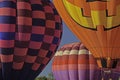 Colorful hot air balloons compete for space in a clear blue sky. Royalty Free Stock Photo