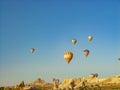 Colorful hot air balloons flying over the Cappadocia valley
