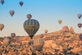 Colorful hot air balloons flying over the Goreme city in Cappadocia Royalty Free Stock Photo