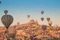 Colorful hot air balloons flying over the Goreme city in Cappadocia Royalty Free Stock Photo