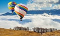 Colorful hot-air balloons flying over the mountain.Artistic pict Royalty Free Stock Photo